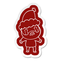 cartoon  sticker of a bearded man crying wearing santa hat