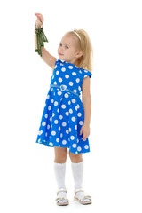 Little girl is holding keys to the door.