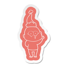 cartoon  sticker of a bald man staring wearing santa hat