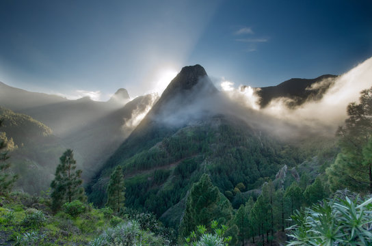 Roque Zarcita seen from the trail to La Laja towards El Cedro during sunset, with Roque de Agando in the background, Garajonay National Park, La Gomera, Spain