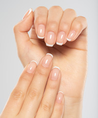  Beautiful female hands. Woman hands with beautiful french manicure, nails.