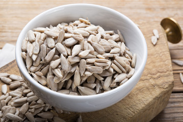 Sunflower seeds on wood background