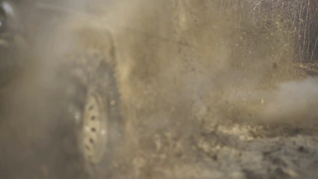 Water splash in off-road racing. Scene of mud splash in off-road racing. SUV or offroad cars crossing water stream. Car racing with creek on way. Extreme driving, competition and 4x4 vehicles concept.