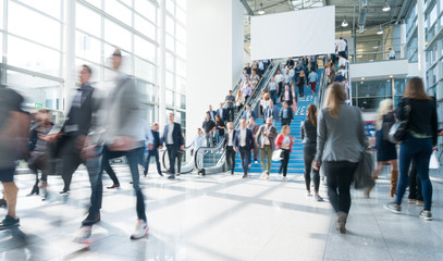 blurred people at a trade fair