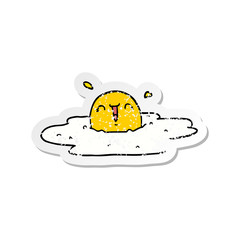distressed sticker of a cartoon fried egg