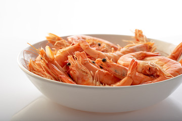 a plate with boiled shrimps