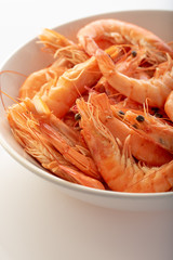 a plate with boiled shrimps