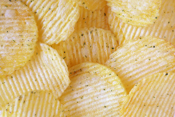 Golden wavy chips close-up