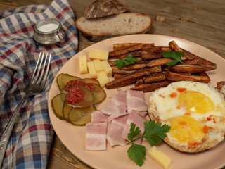 Breakfast fried eggs, bacon, potatoes