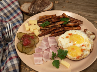 Breakfast fried eggs, bacon, potatoes