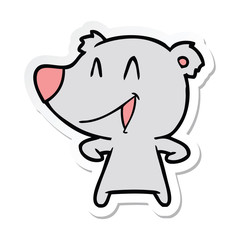 sticker of a laughing bear cartoon