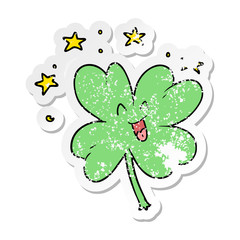 distressed sticker of a happy cartoon four leaf clover