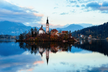 Fototapeta na wymiar Beautiful landscape and Bled Lake and Church in Slovenia sunset