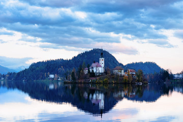 Fototapeta na wymiar Beautiful landscape of Bled Lake and Church in Slovenia sunset