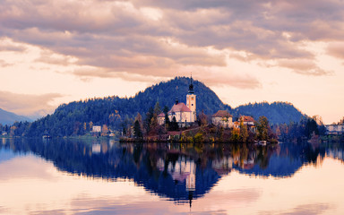 Fototapeta na wymiar Beautiful landscape with Bled Lake and Church in Slovenia sunset