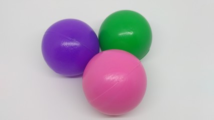 Three colorful plastic balls