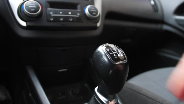 Driver Changing Gears with Manual Transmission Gear Stick
