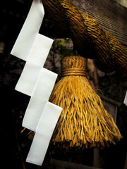 Shide (paper streamers) and Shimenawa (straw rope), traditional ritual objects found at the entrace of Japanese Shinto shrines