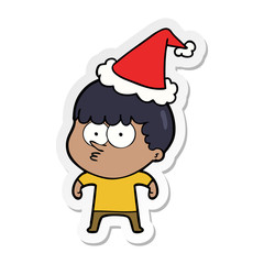 sticker cartoon of a curious boy wearing santa hat