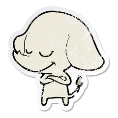 distressed sticker of a cartoon smiling elephant with crossed arms