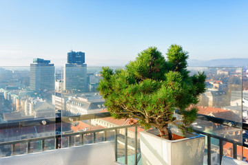 Empty street cafe with panoramic background of Ljubljana Slovenia sunrise