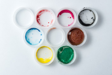 small cans of colorful gouache paint on the whole frame