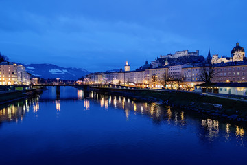 Fototapeta na wymiar Old city Hohensalzburg castle near Salzach River Salzburg evening