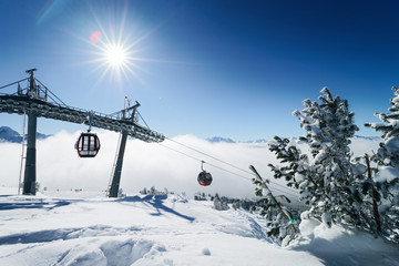 Ski lifts and Clouds in Zillertal Arena ski resort Austria