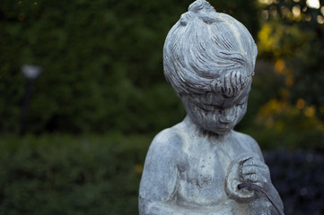 Obraz premium Old weathered garden statue.