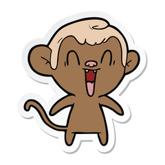 sticker of a cartoon laughing monkey