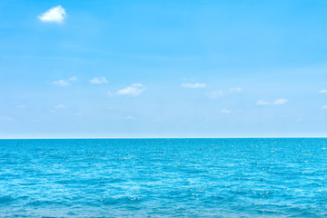 Fototapeta na wymiar Natural tropical sea surface summer with blue sky background. Travel tropical Ocean sea.
