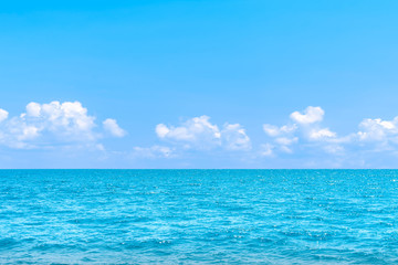 Plakat Natural tropical sea surface summer with blue sky background. Travel tropical Ocean sea.