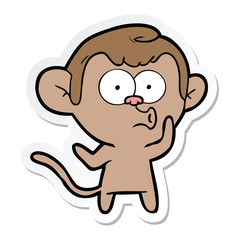 sticker of a cartoon hooting monkey