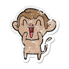 distressed sticker of a cartoon laughing monkey