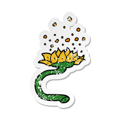 distressed sticker of a cartoon flower releasing pollen