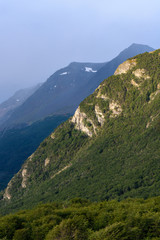 Late afternoon sun highlighting rocky hillside in a stormy background, Cerro Alarken Nature Reserve, Ushuaia, Argentina