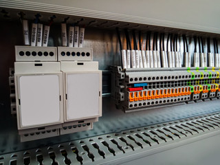 Electrical background. Group of terminal connections,  relay protection unit