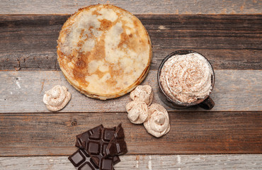 Healthy breakfast, coffee and homemade pancakes on wooden table