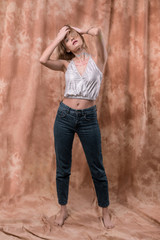 Attractive magnetic young woman touching her hair