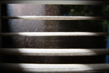 Dust and Dirty mosquito wire screen window, Dust blinds inside a window, Light & Shadow shot, Close...
