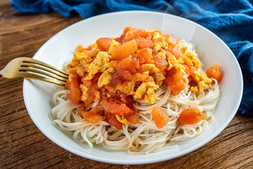 Scrambled egg noodles with tomatoes