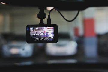 video camera recorder inside vehicle in car park