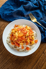 Scrambled egg noodles with tomatoes