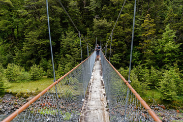 A close up of a swing bridge, used for crossing rivers on walks in New Zealand