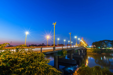 Fototapeta premium The color of Night traffic light on the road on the bridge (Suphankanlaya Bridge) in Phitsanulok, Thailand.