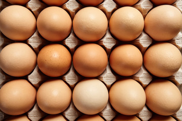 Eggs in cardboard box.Top view.