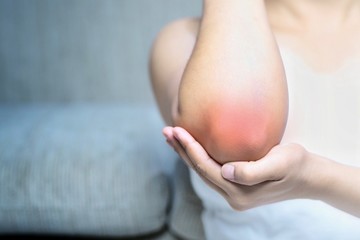Bone pain or muscle pain around the elbow.