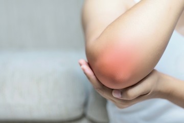 Bone pain or muscle pain around the elbow.