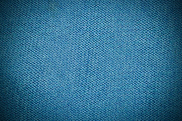 blue knitting wool texture with vignette background. fabric cloth