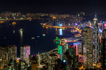 Naklejka premium Hong Kong city view from The Peak at night, Victoria Harbor view from Victoria Peak at night, Hong Kong.